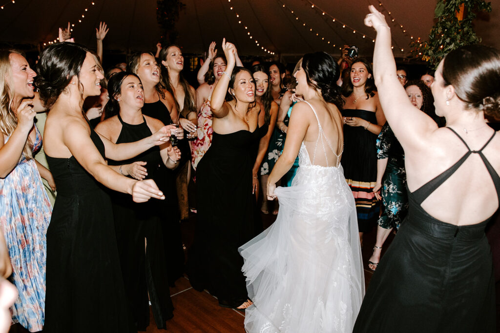 bride dancing with bridesmaids