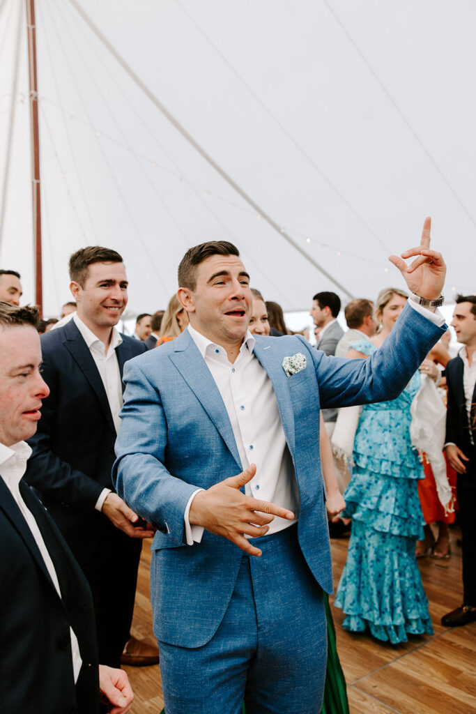 groom dancing during reception