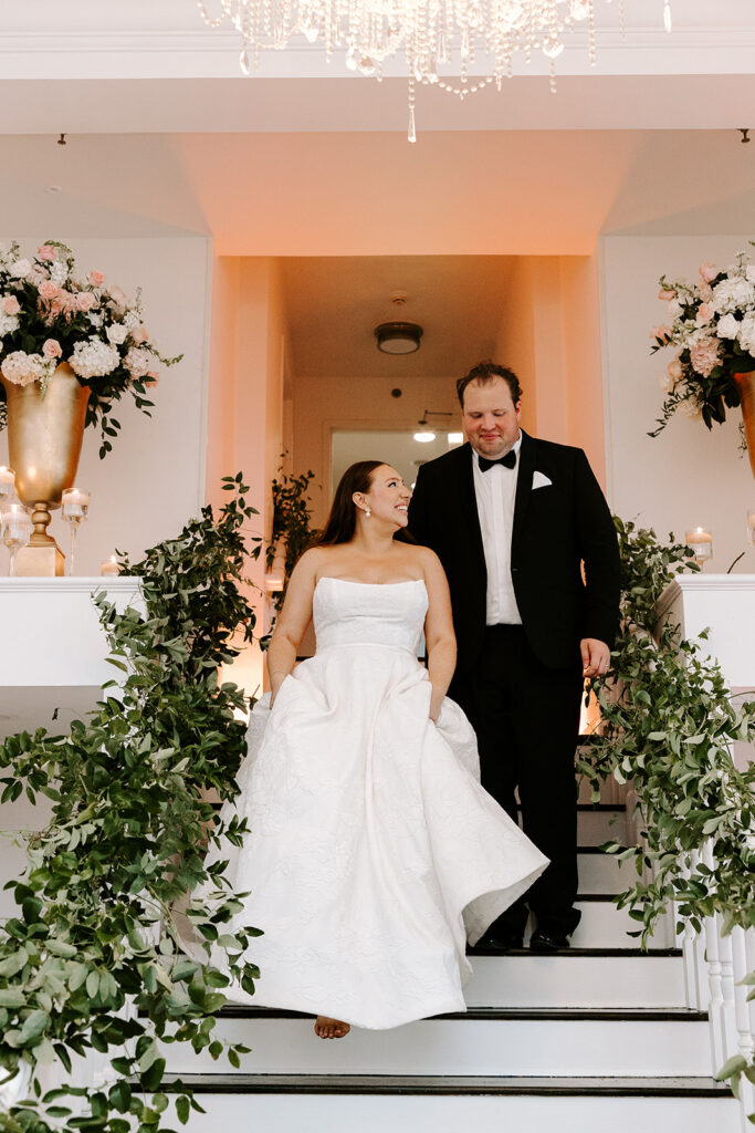 bride and groom entering the reception space
