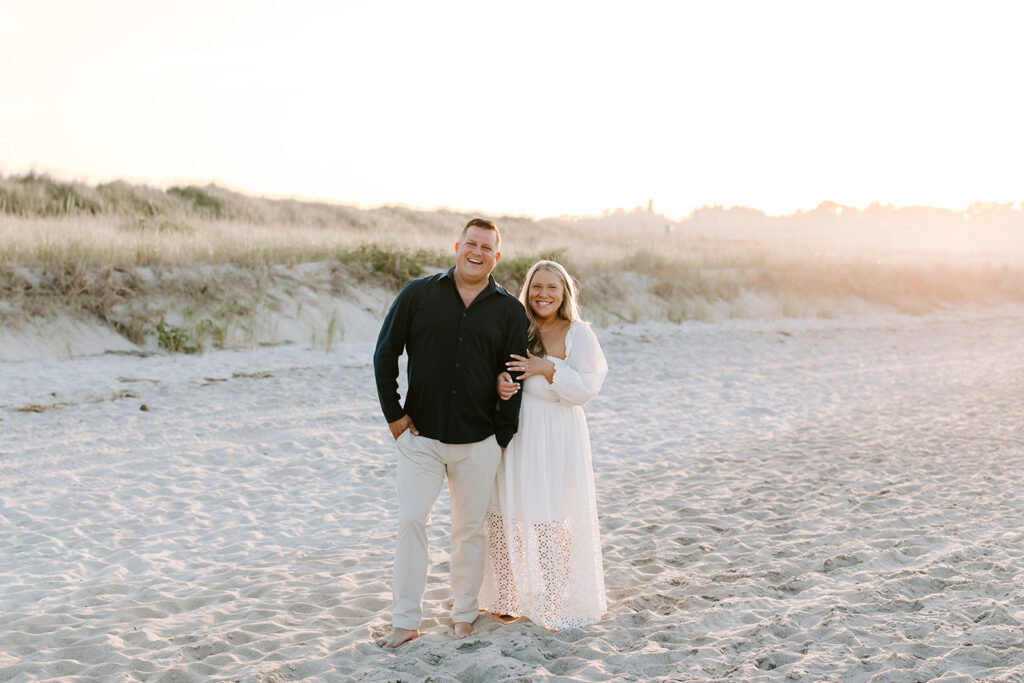 Sunset glow over Crane Beach with couple holding hands