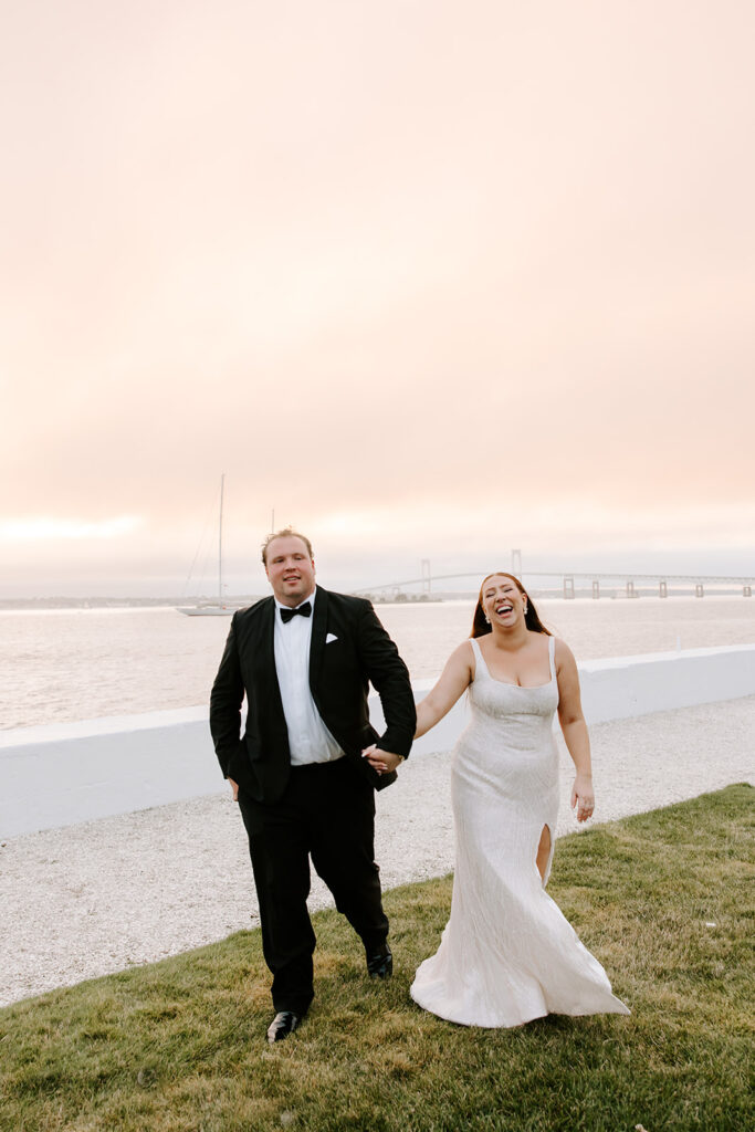 The sky was painted in soft pink and orange hues as they embraced along the Belle Mer lawn.