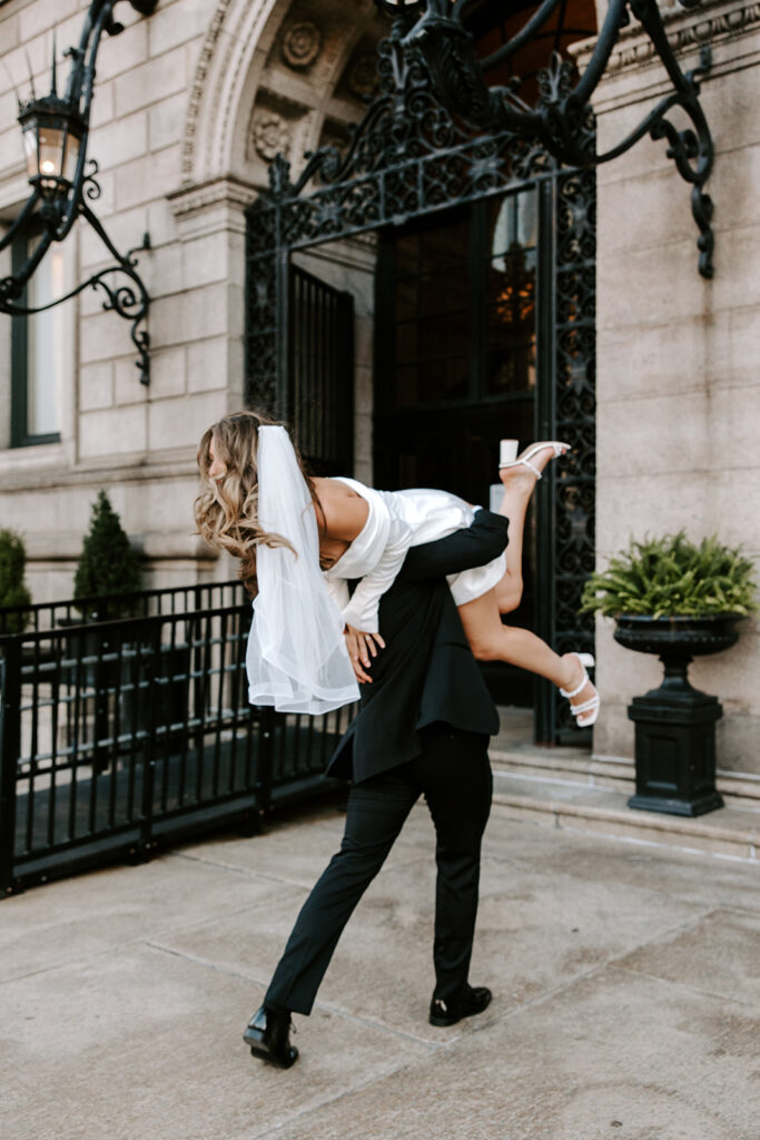 Soft, natural light engagement photo on marble staircase