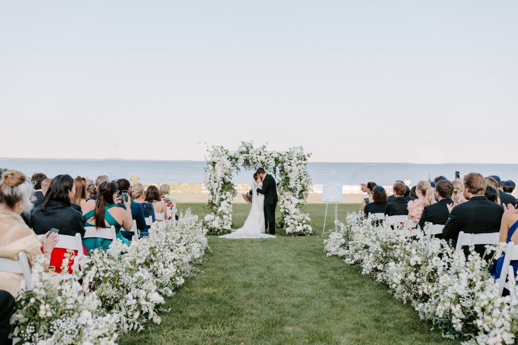 wedding ceremony on the oceanfront lawn at Rosecliff Mansion Newport wedding photographer
