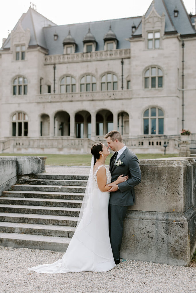 Bride and groom on the oceanfront terrace at Ochre Court Salve Regina Newport RI